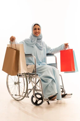 Saudi Woman in Wheelchair with Shopping Bags