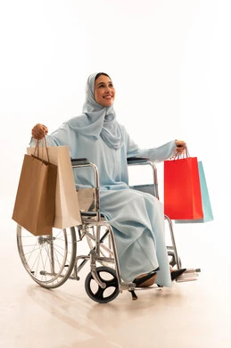 Arab Woman in Wheelchair with Shopping Bags