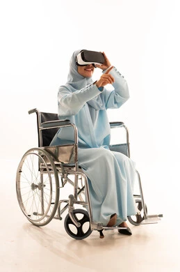Arab Woman in Wheelchair Using VR Headset in Studio