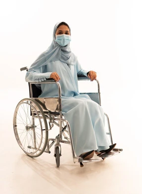Arab Woman in Wheelchair Wearing Face Mask