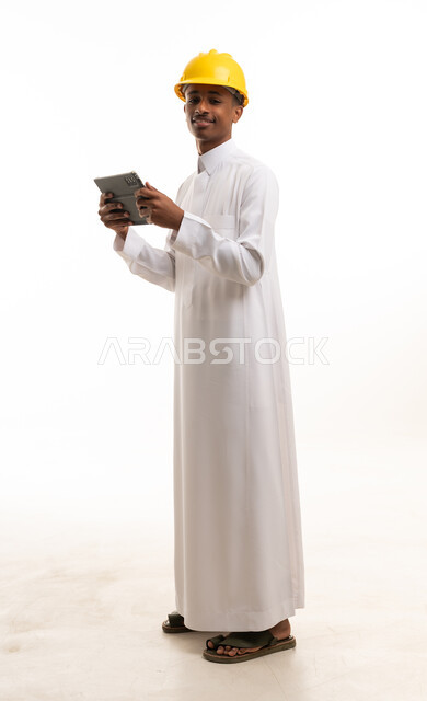 Saudi Engineer in Thobe with Hard Hat and Tablet