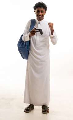 Saudi Student in Thobe Holding Video Game Controller