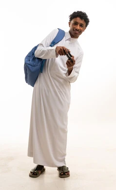 Saudi Student in Thobe Using Smartphone with Backpack