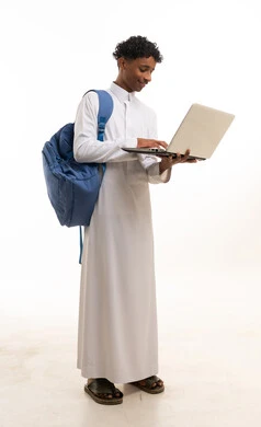Saudi Student Wearing Thobe Using Laptop and Backpack