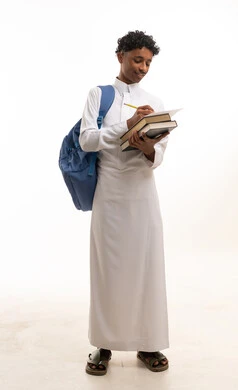 Young Saudi Student in Thobe Writing with Backpack
