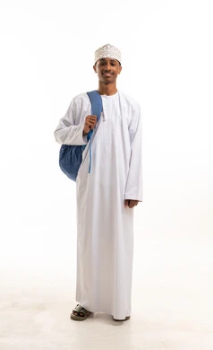Omani Student in Traditional Dishdasha and Kummah