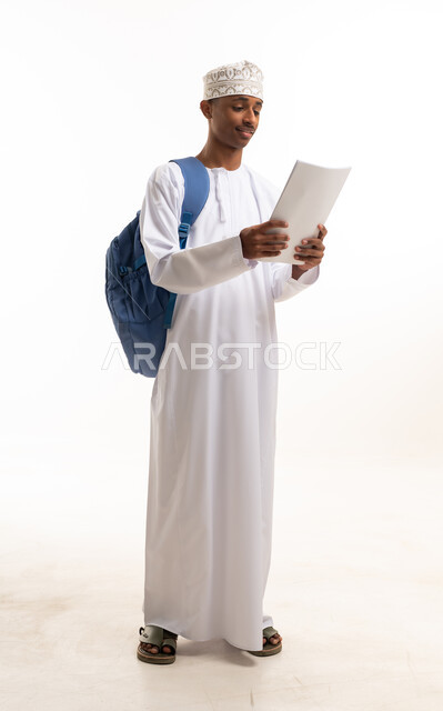 Omani Student in Traditional Dress with Backpack