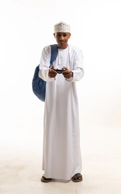 Omani Man Gamer with Controller and Backpack Studio Shot
