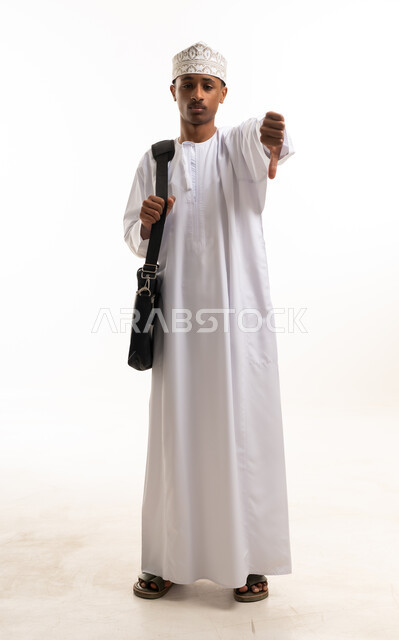 Omani Man Gesturing Thumbs Down in Traditional Dress