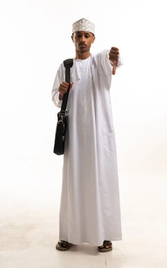 Omani Man Gesturing Thumbs Down in Traditional Dress