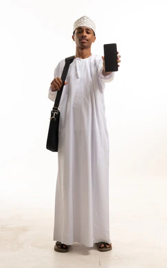 Omani Man in Traditional Dress Holding Smartphone