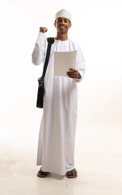 Omani Man Celebrating Success with Document in Studio