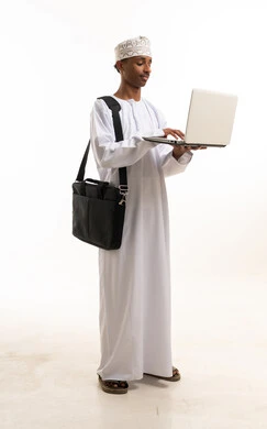 Omani Man Using Laptop on White Background