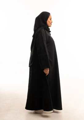 Saudi Woman in Traditional Black Abaya Profile View