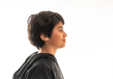 Saudi Boy in Black Hoodie Side Profile Portrait