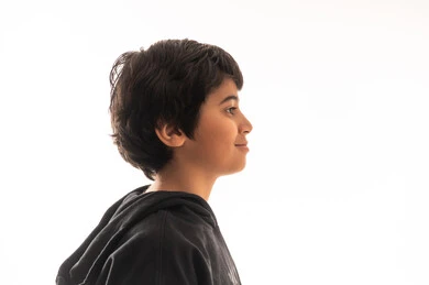 Saudi Boy in Black Hoodie Profile View White Background