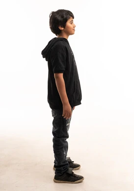 Arab Boy in Casual Wear Standing Side Profile View