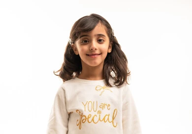 Smiling Saudi Girl in Casual White Sweatshirt Portrait