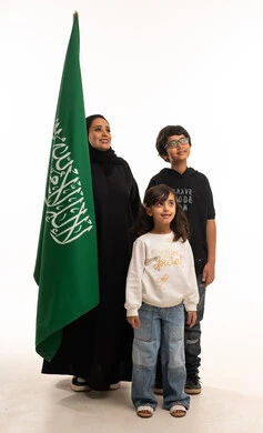 Saudi Woman and Children with Saudi Flag Studio