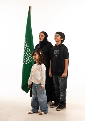 Saudi Mother and Children with National Flag Studio