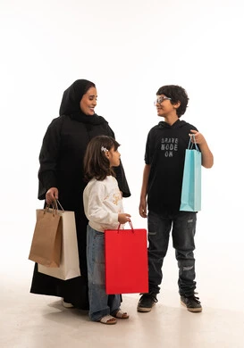 Saudi Mother and Children with Shopping Bags