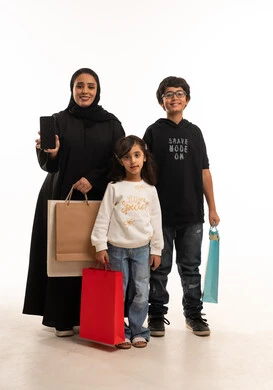 Saudi Woman and Children with Shopping Bags and Smartphone