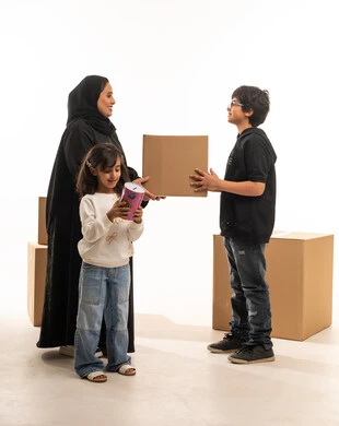 Saudi Mother and Children with Cardboard Delivery Boxes