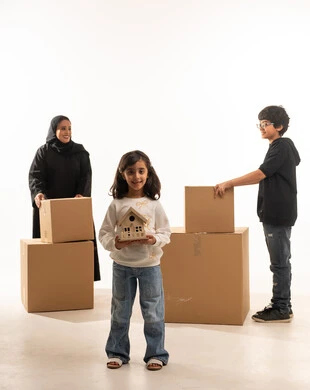 Saudi Family Moving House with Cardboard Boxes