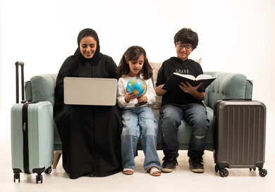 Saudi Mother and Children Planning Travel with Suitcases