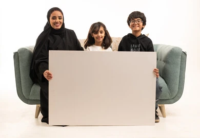 Saudi Mother and Children Holding Blank White Board