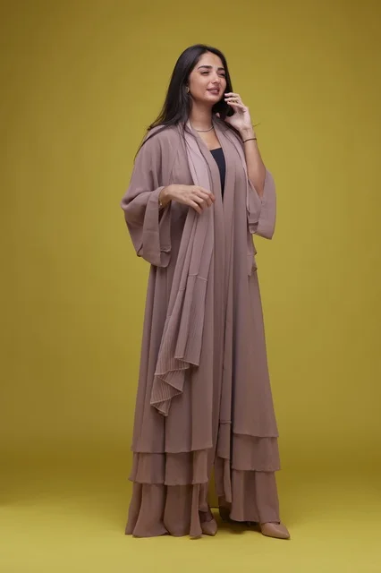 Saudi Woman in Beige Abaya Using Smartphone