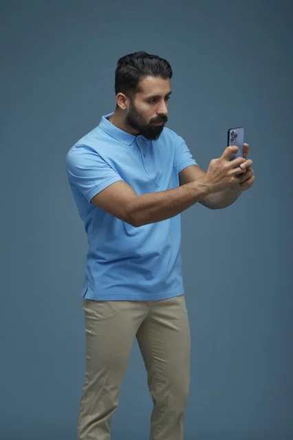 Saudi Man Taking Selfie with Smartphone in Studio