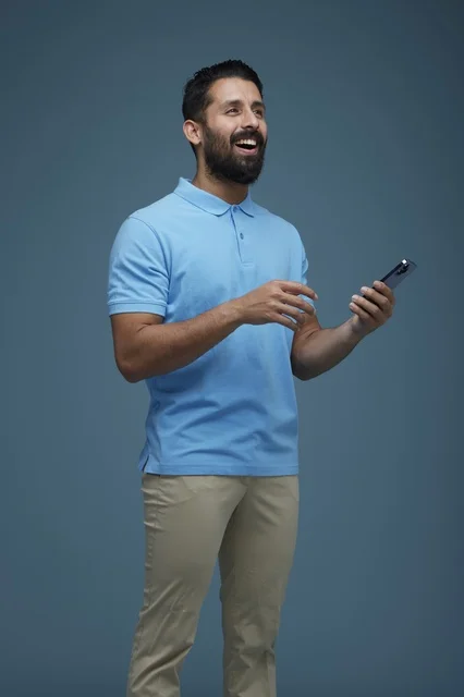 Saudi Man Interacting with Smartphone in Studio