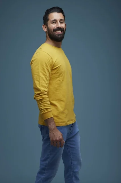 Saudi Man in Casual Yellow Shirt on Blue Background