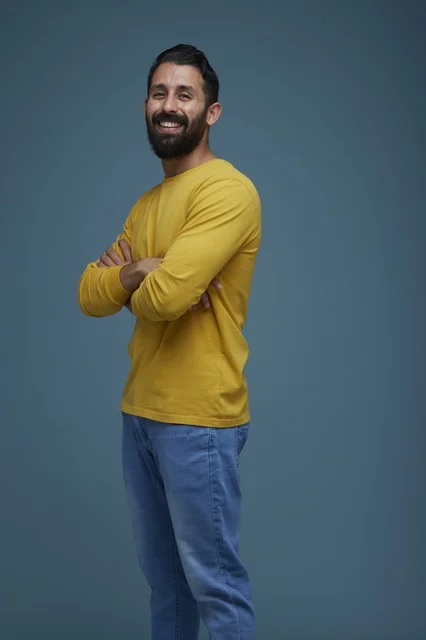 Smiling Saudi Man in Yellow Casual Shirt Studio Portrait