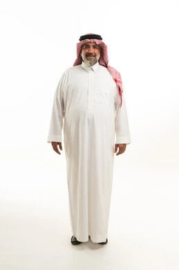 Saudi Man in Traditional White Thobe and Red Shemagh