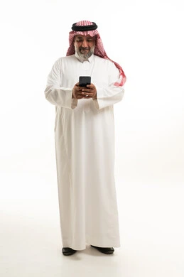 Middle-Aged Saudi Man Using Smartphone in Studio