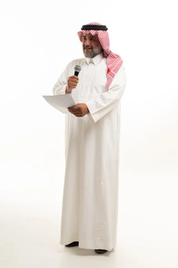 Saudi Man in Traditional Thobe Giving a Speech