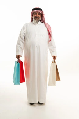 Saudi Man with Shopping Bags in Traditional Thobe