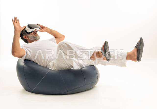 Arab Man in White Thobe Wearing VR Headset Studio