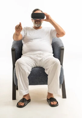 Arab Man Wearing VR Headset Sitting on White Background
