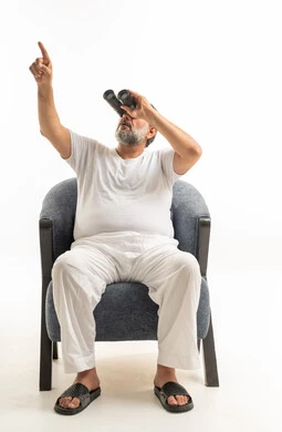 Saudi Man with Binoculars Pointing Up in Studio