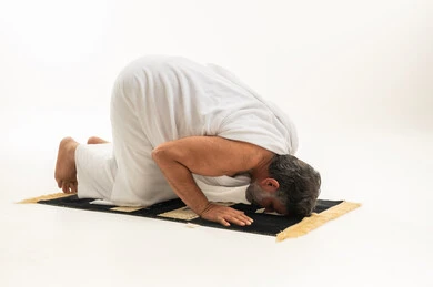 Arab Man in Ihram Performing Sujud Prayer