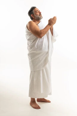 Muslim Man in Ihram Praying on White Background
