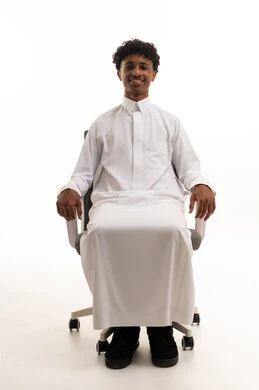 Saudi Man in White Thobe Sitting on Office Chair