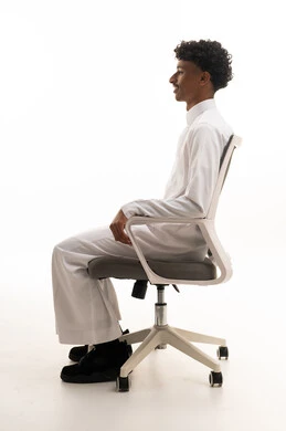 Saudi Man in White Thobe Sitting in Office Chair