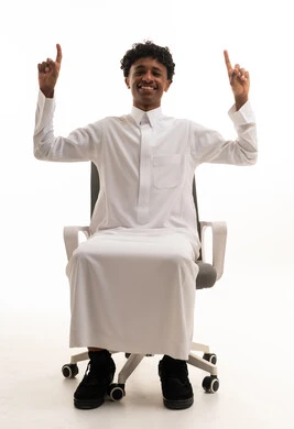 Saudi Man in White Thobe Pointing Up in Office Chair