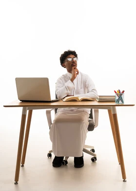 Saudi Man in Traditional Thobe Thinking at Office Desk