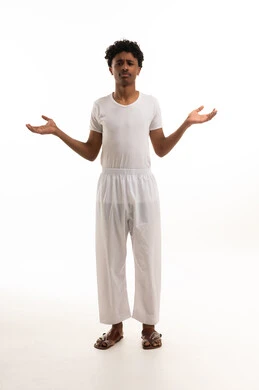 Saudi Man Shrugging in Traditional White Undergarments