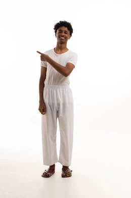 Saudi Man in Traditional Undergarments Pointing Side